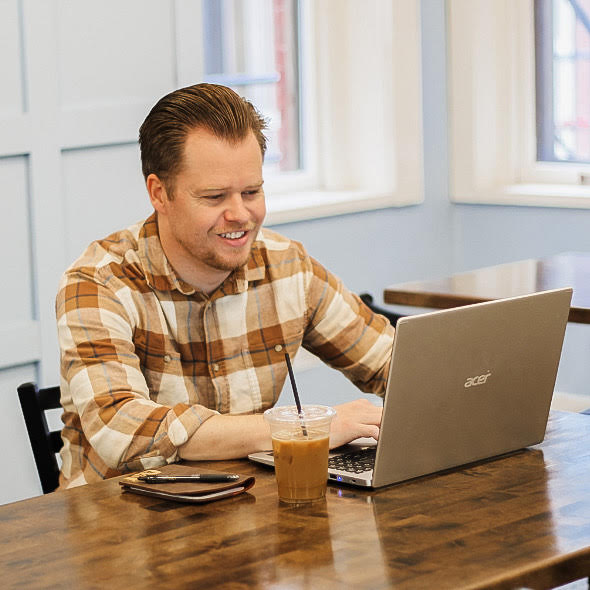 Adam Working on Four Arrows Marketing
